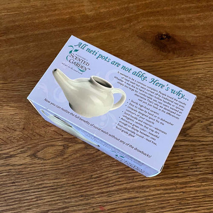 Into the Scented Garden Ceramic Neti Pot Box On a Teak Wood Tabletop