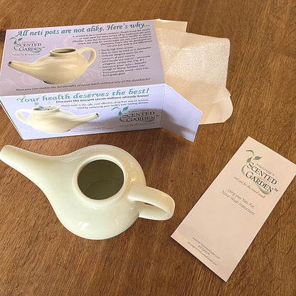 Opened Box for the Neti Pot Showing Box, Pot and Instruction Pamphlet