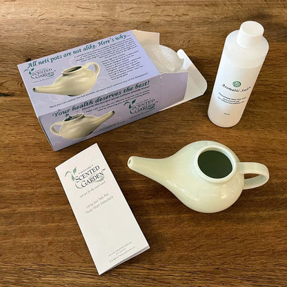 All Elements of a Nasal Irrigation Starter Kit Showing Box, Pamphlet, Neti Pot, and Unscented Salt